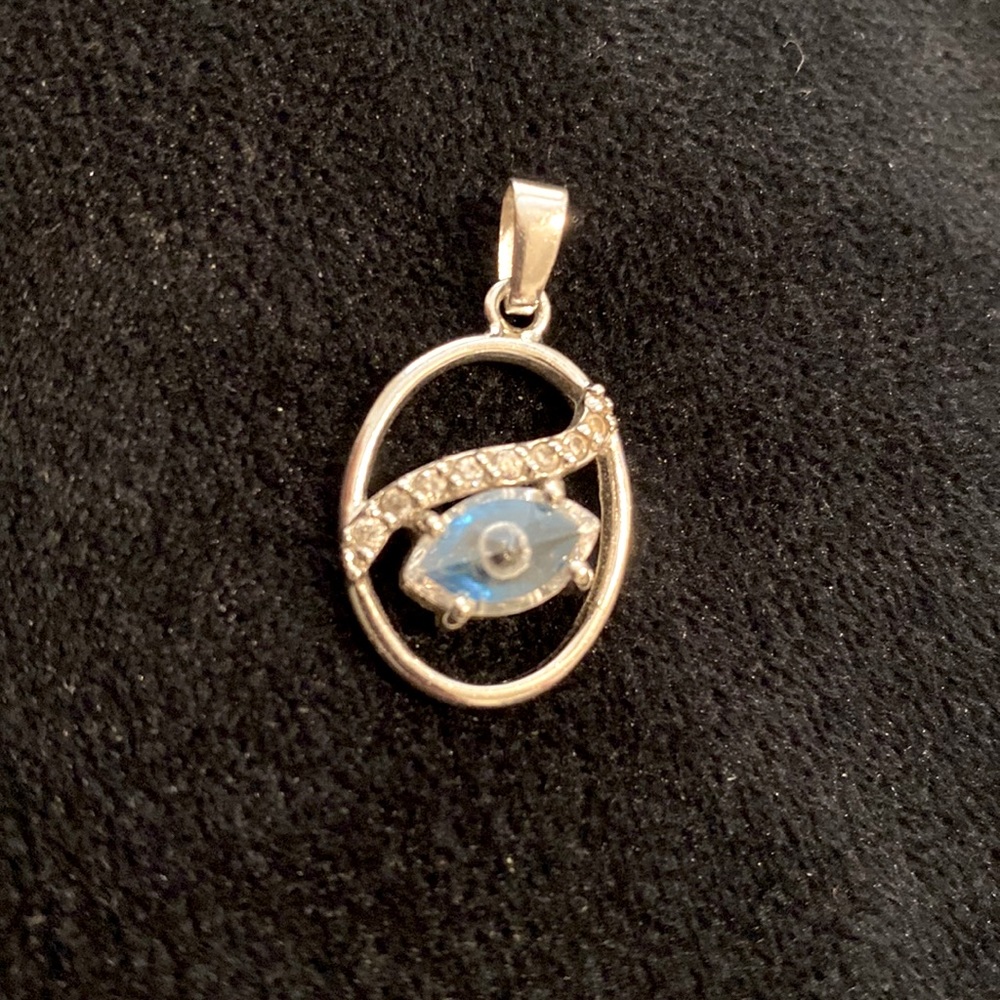 Evil eye silver crystal pendant